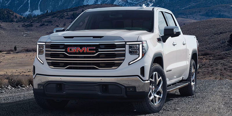 Front view of GMC Sierra 1500 on a mountain road