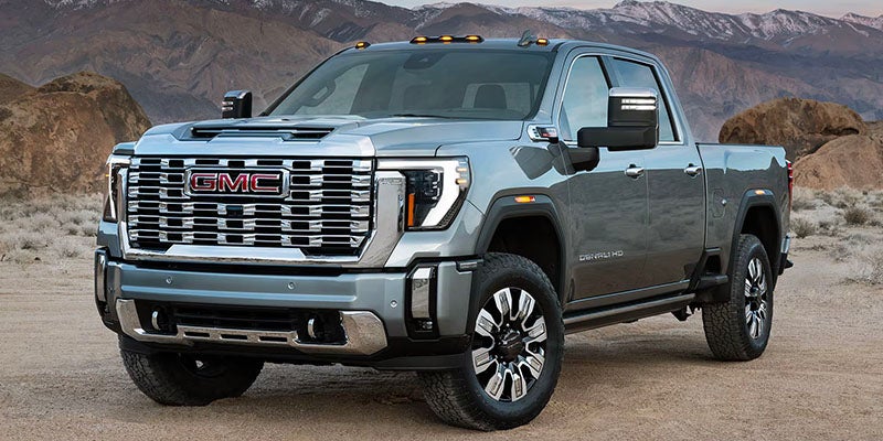 Left side view of 2025 GMC Sierra 2500 parked on a mountain top